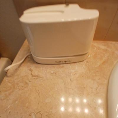 Waterpik machine with razor and a new nightlight