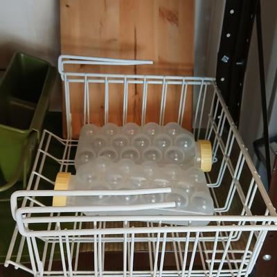 Under the shelf racks, with kitchen dish rack paper plate holders and a nice cutting board