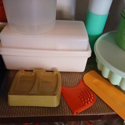 Tupperware brand food storage containers with great utensil gadgets
