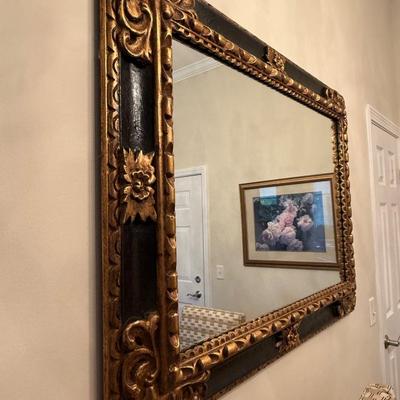 Black and gold adorned mirror
