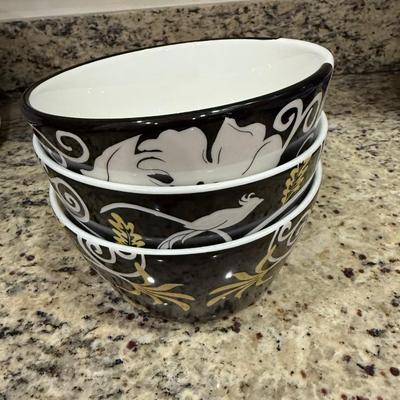 Three black, white and yellow bowls