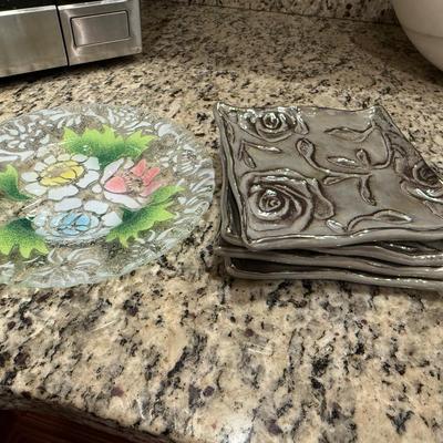 4 hand painted plates and 4 silver square plates