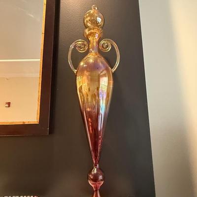Two iridescent decorative glass pieces