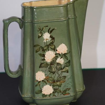 ANTIQUE PAULINE POTTERY OF EDGERTON PITCHER OF 9 1/2" RELIEF OF FLORAL AND LEAVES
