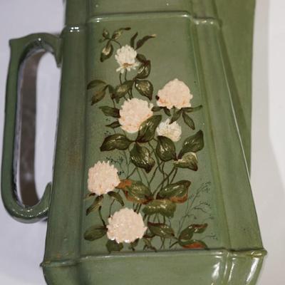 ANTIQUE PAULINE POTTERY OF EDGERTON PITCHER OF 9 1/2" RELIEF OF FLORAL AND LEAVES