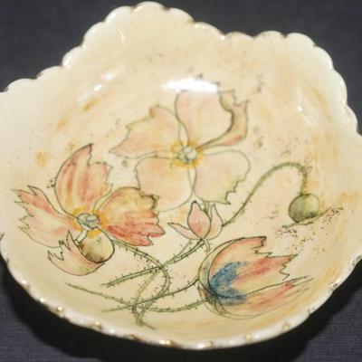 Sale Photo Thumbnail #35: decorated with dogwood flowers on a cream background is an antique pottery berry set made during the late 19th century at the Pauline pottery factory. A rare set. The set consists of a 9 1/2" fluted bowl with six arches, height is 2 - 21/2" 
The edge is e