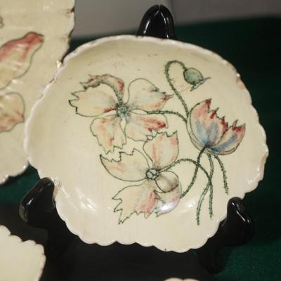 Sale Photo Thumbnail #37: decorated with dogwood flowers on a cream background is an antique pottery berry set made during the late 19th century at the Pauline pottery factory. A rare set. The set consists of a 9 1/2" fluted bowl with six arches, height is 2 - 21/2" 
The edge is e