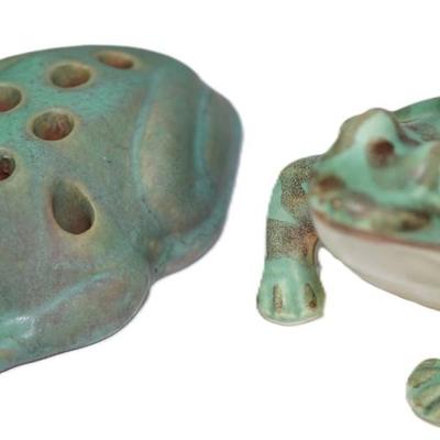 Sale Photo Thumbnail #54: two vintage ceramic frogs. one is a flower frog.. the other is decorative , 
matt glaze. 
the Roseville frog is 5 1/2" by 3 1/2" height about 2" very good condition, Slip glaze of matt medium green over rose-colored glaze. 
The Mc Coy pottery frog is matt