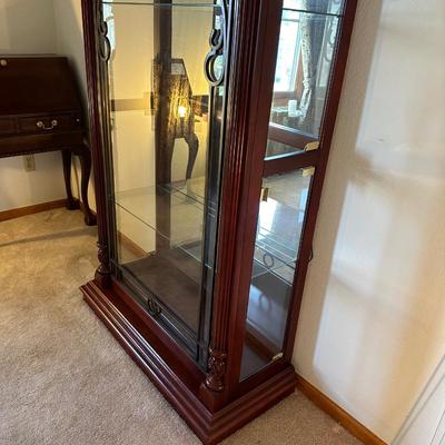 ORNATE LIGHTED CURIO CABINET WITH MIRRORED BACK