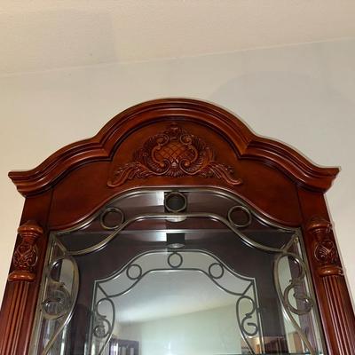 ORNATE LIGHTED CURIO CABINET WITH MIRRORED BACK
