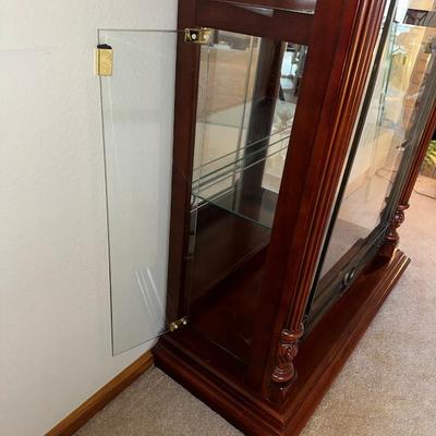 ORNATE LIGHTED CURIO CABINET WITH MIRRORED BACK