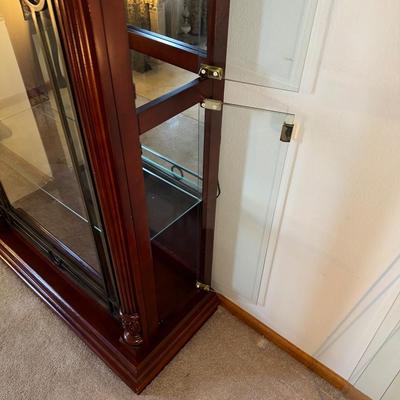 ORNATE LIGHTED CURIO CABINET WITH MIRRORED BACK