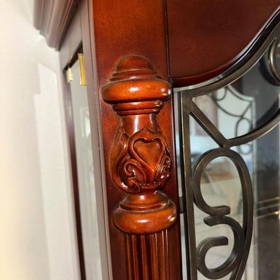 ORNATE LIGHTED CURIO CABINET WITH MIRRORED BACK