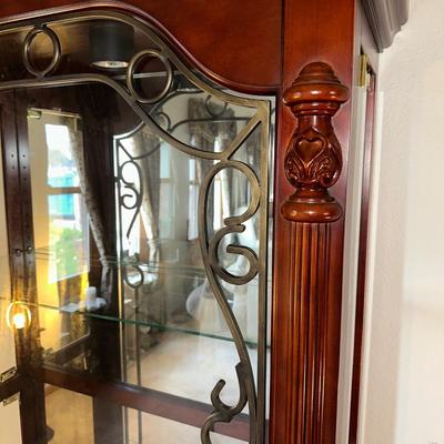 ORNATE LIGHTED CURIO CABINET WITH MIRRORED BACK