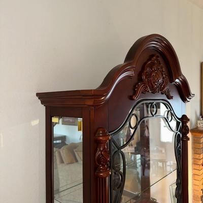 ORNATE LIGHTED CURIO CABINET WITH MIRRORED BACK