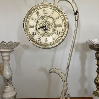 HANGING CLOCK ON AN IRON FRAME AND 2 FLOOR PILLAR CANDLE HOLDERS