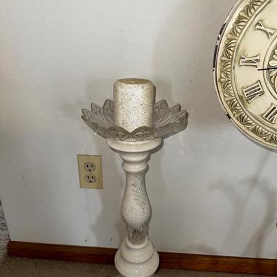 HANGING CLOCK ON AN IRON FRAME AND 2 FLOOR PILLAR CANDLE HOLDERS