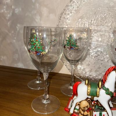 HOLIDAY GLASS PLATTER, STEMMED GLASSES AND A ROCKING HORSE