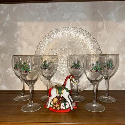 HOLIDAY GLASS PLATTER, STEMMED GLASSES AND A ROCKING HORSE