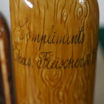 GROUPING OF THREE GERMAN ANTIQUE CERAMIC LIQUOR FLASKS - CHARACTER FORMS