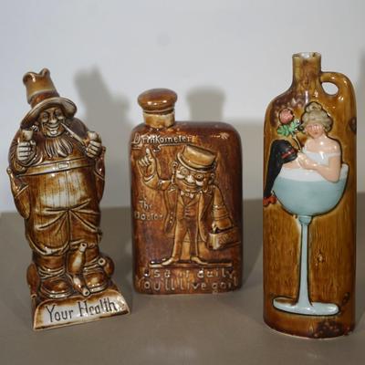 GROUPING OF THREE GERMAN ANTIQUE CERAMIC LIQUOR FLASKS - CHARACTER FORMS