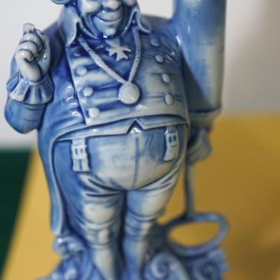 GROUPING OF THREE BLUE AND WHITE GERMAN CHARACTER PORCELAIN LIQUOR FLASKS