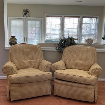 010 Pair of Jessica Charles Upholstered Swivel Club Chairs