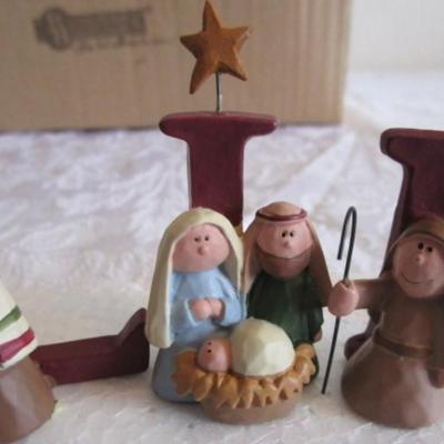 Miniature nativity set, also spells "Believe"