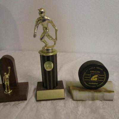 2 baseball trophies, 1 hockey trophy
