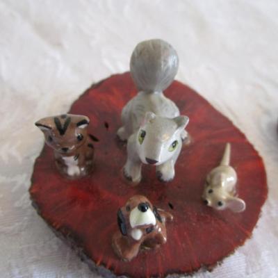 Dinnell's ceramic figurines on wood slab (2)