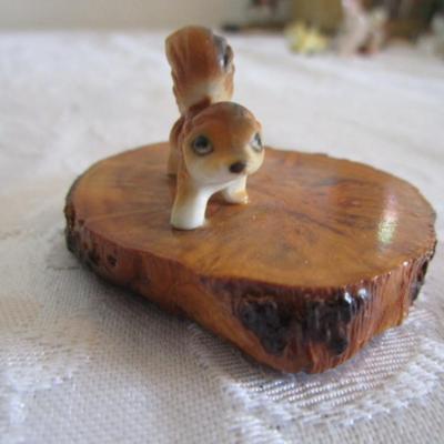 Dinnell's ceramic figurines on wood slab (2)