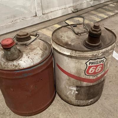 Multiple vintage gas cans