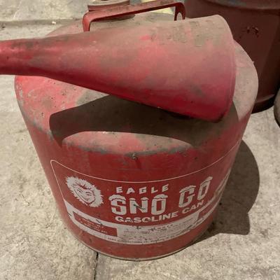 Multiple vintage gas cans