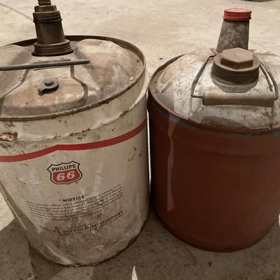 Multiple vintage gas cans