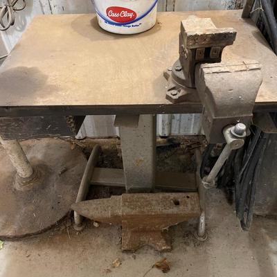 Anvil and metal table with vise