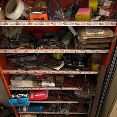 Orange metal shelf with everything on it