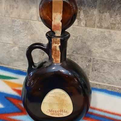 Cowboy ceramic Art Statue and Vintage Old Fitzgerald whisky bottle with horse