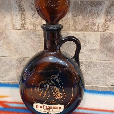 Cowboy ceramic Art Statue and Vintage Old Fitzgerald whisky bottle with horse