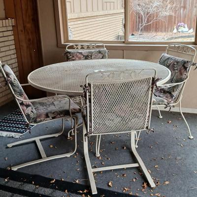 54" Wrought iron mesh patio table with 4 wrought iron mesh chairs and cushions