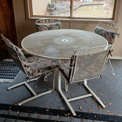 54" Wrought iron mesh patio table with 4 wrought iron mesh chairs and cushions