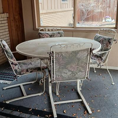 54" Wrought iron mesh patio table with 4 wrought iron mesh chairs and cushions