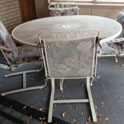 54" Wrought iron mesh patio table with 4 wrought iron mesh chairs and cushions