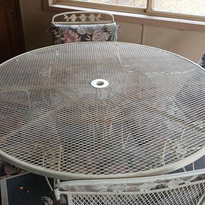 54" Wrought iron mesh patio table with 4 wrought iron mesh chairs and cushions
