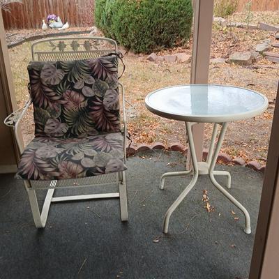 Wrought iron mesh patio chair with cushion and metal base glass topped patio table