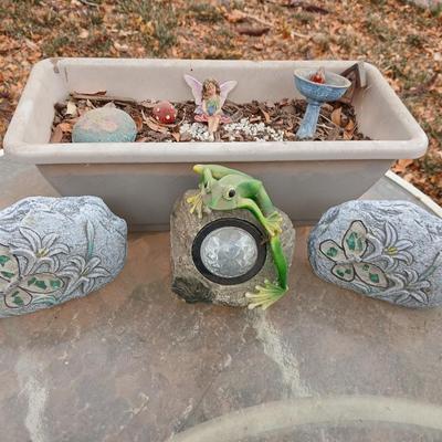 Small Fairy Garden in a pot with two faux decorative rocks and a Solar frog light