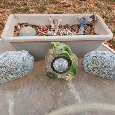 Small Fairy Garden in a pot with two faux decorative rocks and a Solar frog light