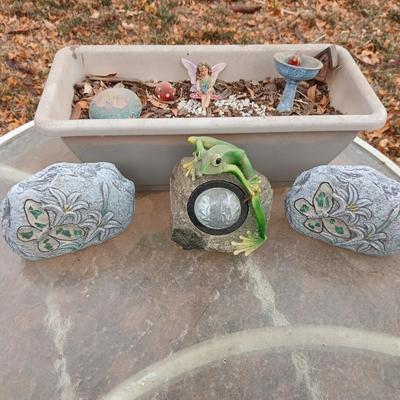 Small Fairy Garden in a pot with two faux decorative rocks and a Solar frog light