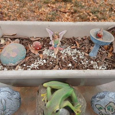 Small Fairy Garden in a pot with two faux decorative rocks and a Solar frog light