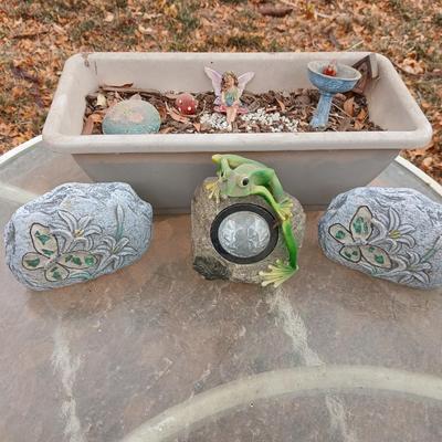 Small Fairy Garden in a pot with two faux decorative rocks and a Solar frog light