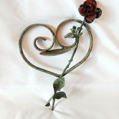 Beautiful tin vase with rose and hanging iron heart with rose candle holder